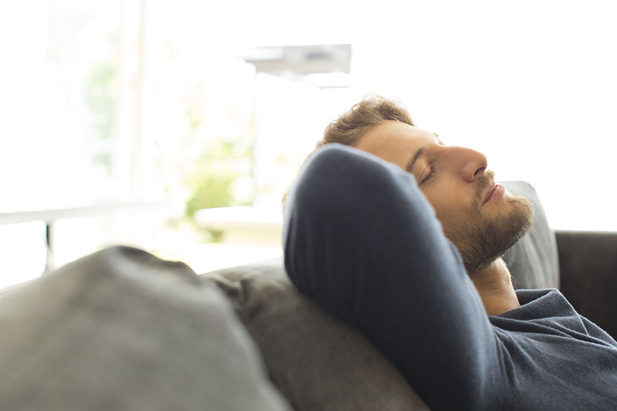 Couple Rests at Home While Recovering From a Tooth Extraction